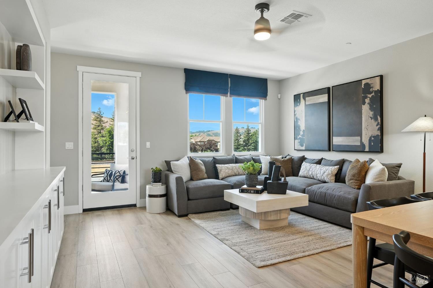104 Cardamom Lane, Unit 1103 Morgan Hill, CA 95037 - Photo 6 of 19 a living room with furniture and a large window