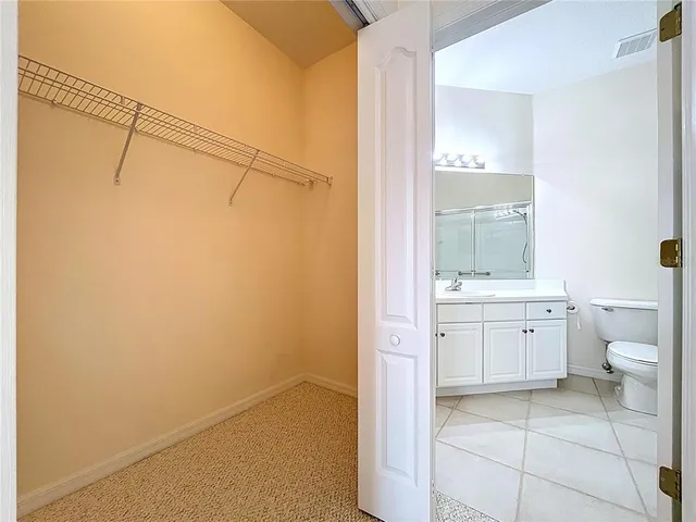 an aerial view of a house with outdoor space and a lake view