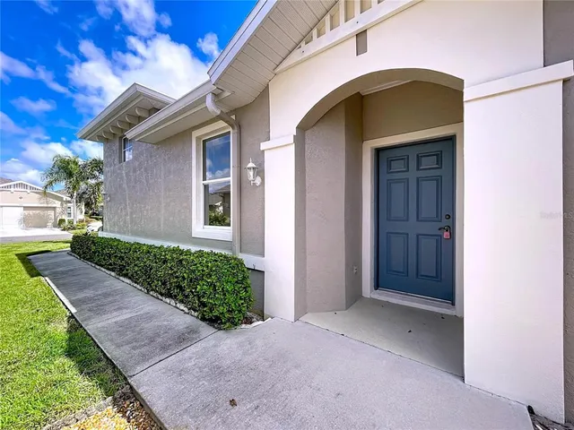a view of a kitchen with a sink and dishwasher a refrigerator with white cabinets