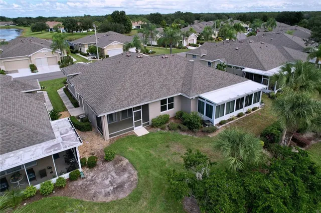 a view of a kitchen with a sink and a chandelier fan