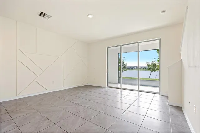 a view of a kitchen with kitchen island wooden floor center island and stainless steel appliances