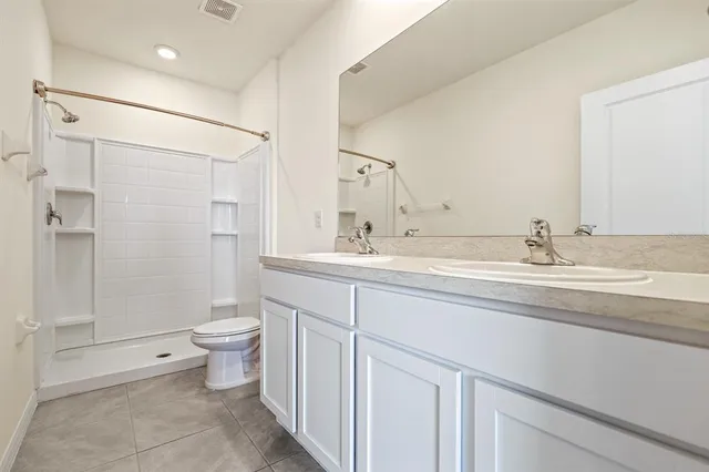 an empty room with an entryway and window