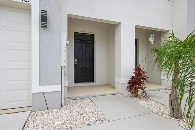hallway with potted plants