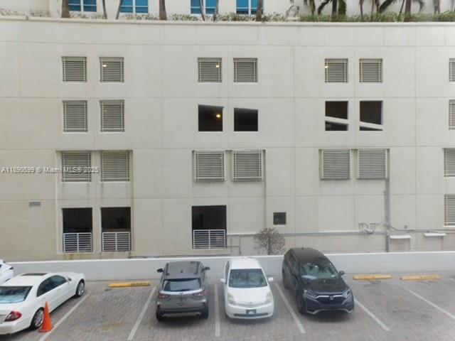 5005 Collins Avenue, Unit 322 Miami Beach, FL 33140 - Photo 14 of 15 a car parked in front of a building