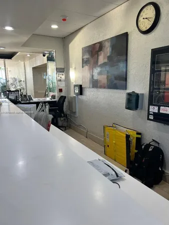 a room with gym equipment and a large window