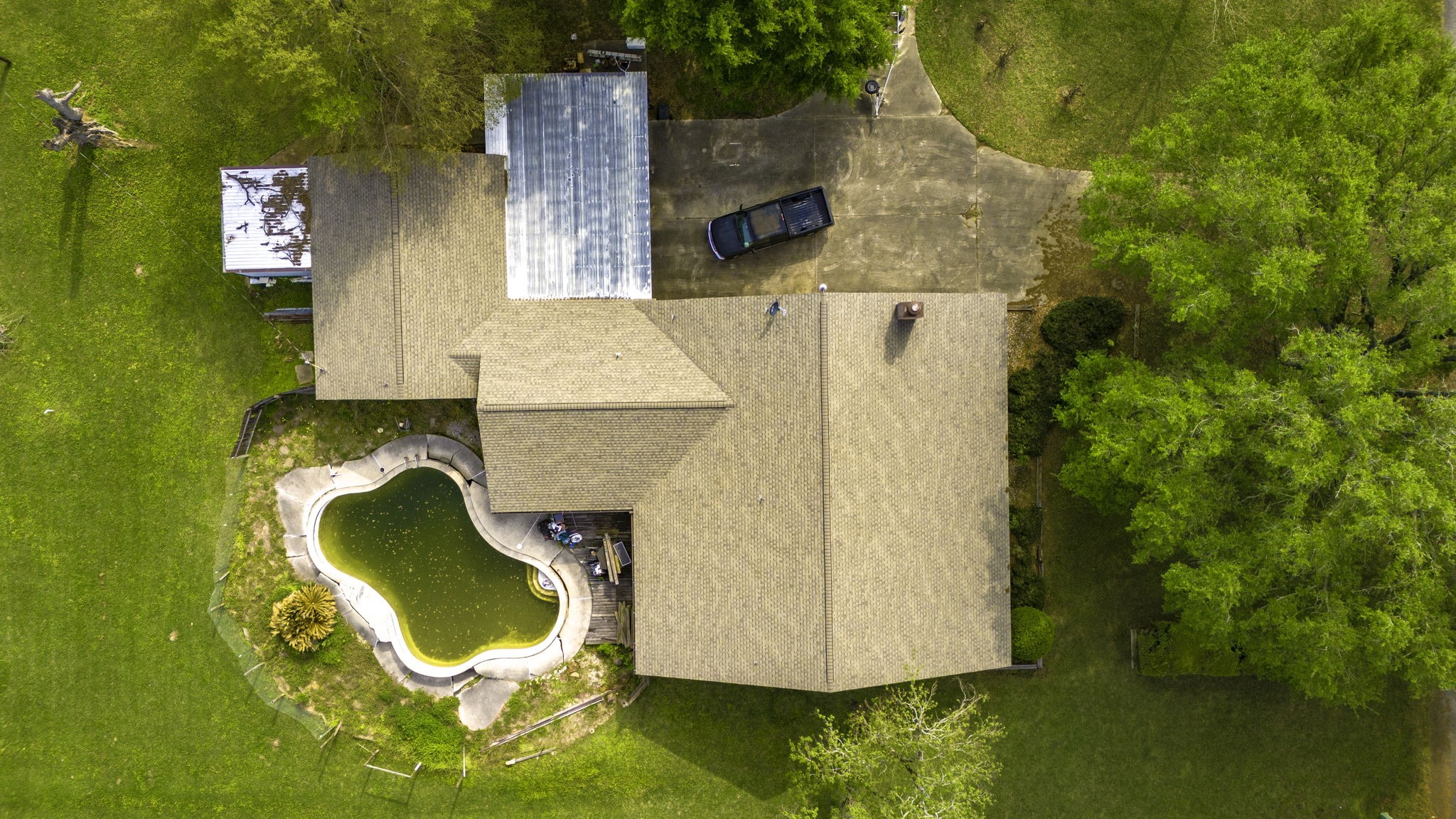 5534 Avanak Street Spring, TX 77389 - Photo 8 of 13 Great roof job! Look at that footprint! Oh, that concrete driveway is perfect for your vehicles, RV, ATV, trailers...etc. Build an iron rod fence and protect your property in style like the neighbors! One side is already done for you!