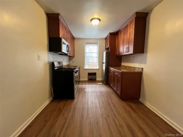 a view of a kitchen from the hallway