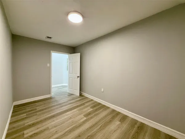 a bathroom with a sink vanity mirror and toilet
