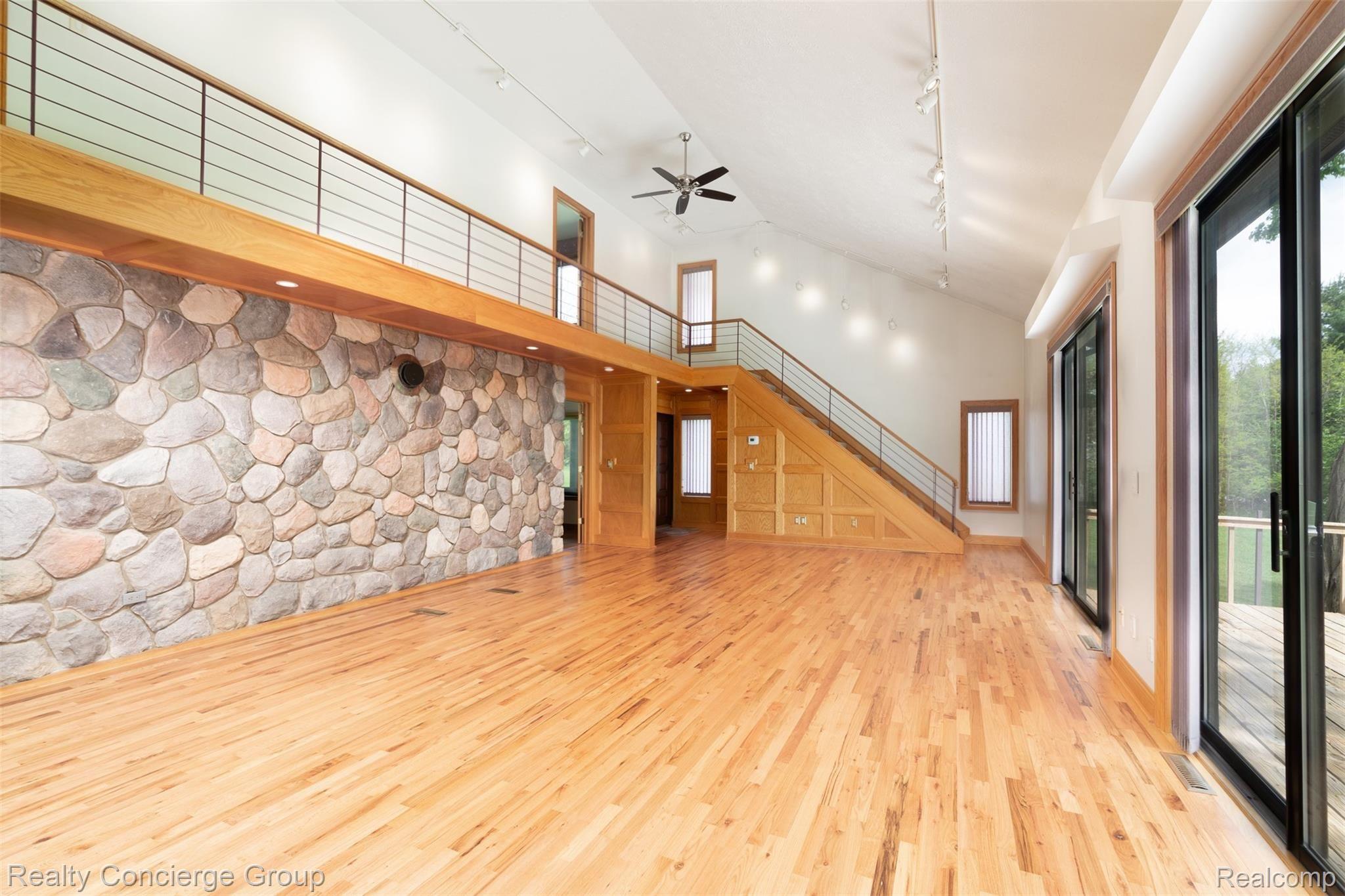 Large loft hallway and high ceilings create an open & airy feel in the central part of this home 
