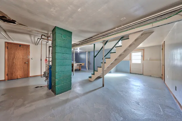 a view of entryway with stairs and wooden floor