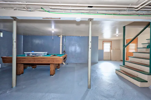 a lobby with furniture and wooden floor