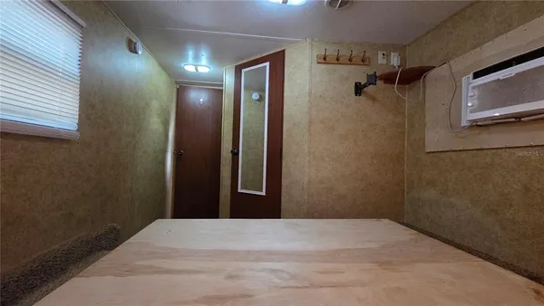 a bathroom with a toilet a sink and a mirror
