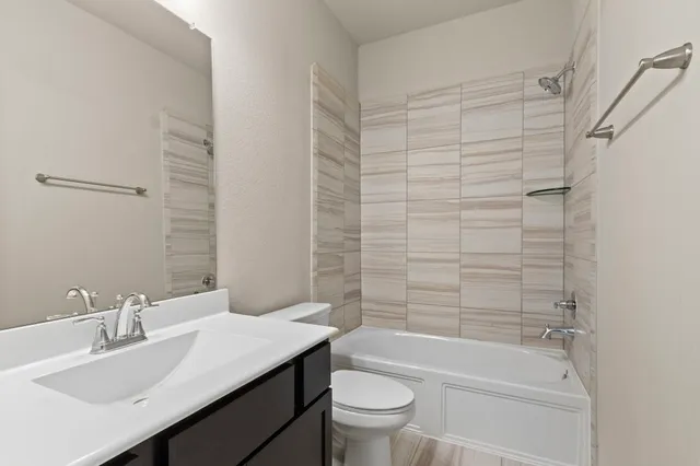 a view of a house with wooden floor and a yard with plants