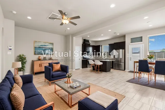 a living room with furniture and kitchen view