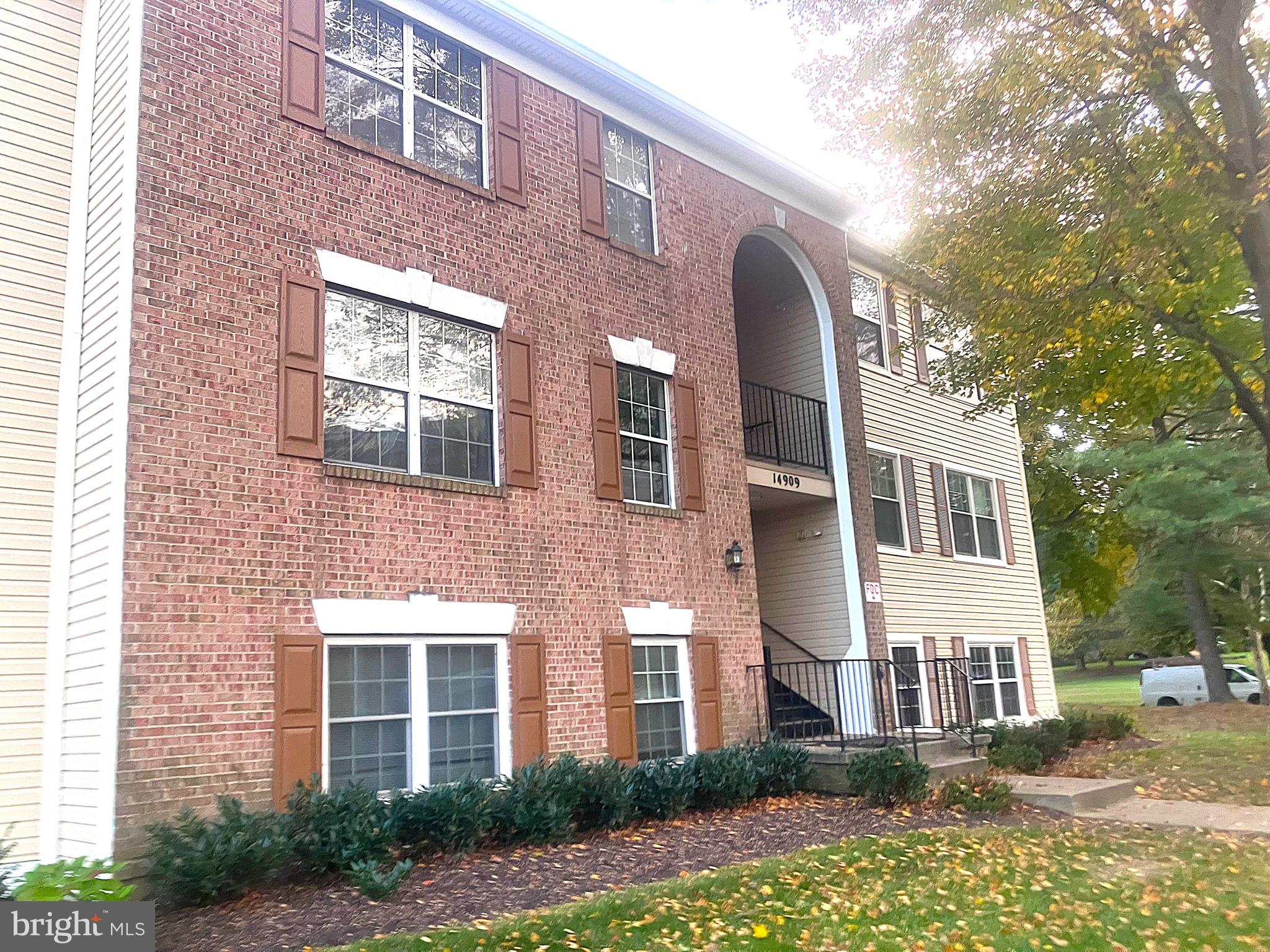 14909 Cleese Court, Unit 4CA Silver Spring, MD 20906 - Photo 2 of 43 a front view of a house with a yard