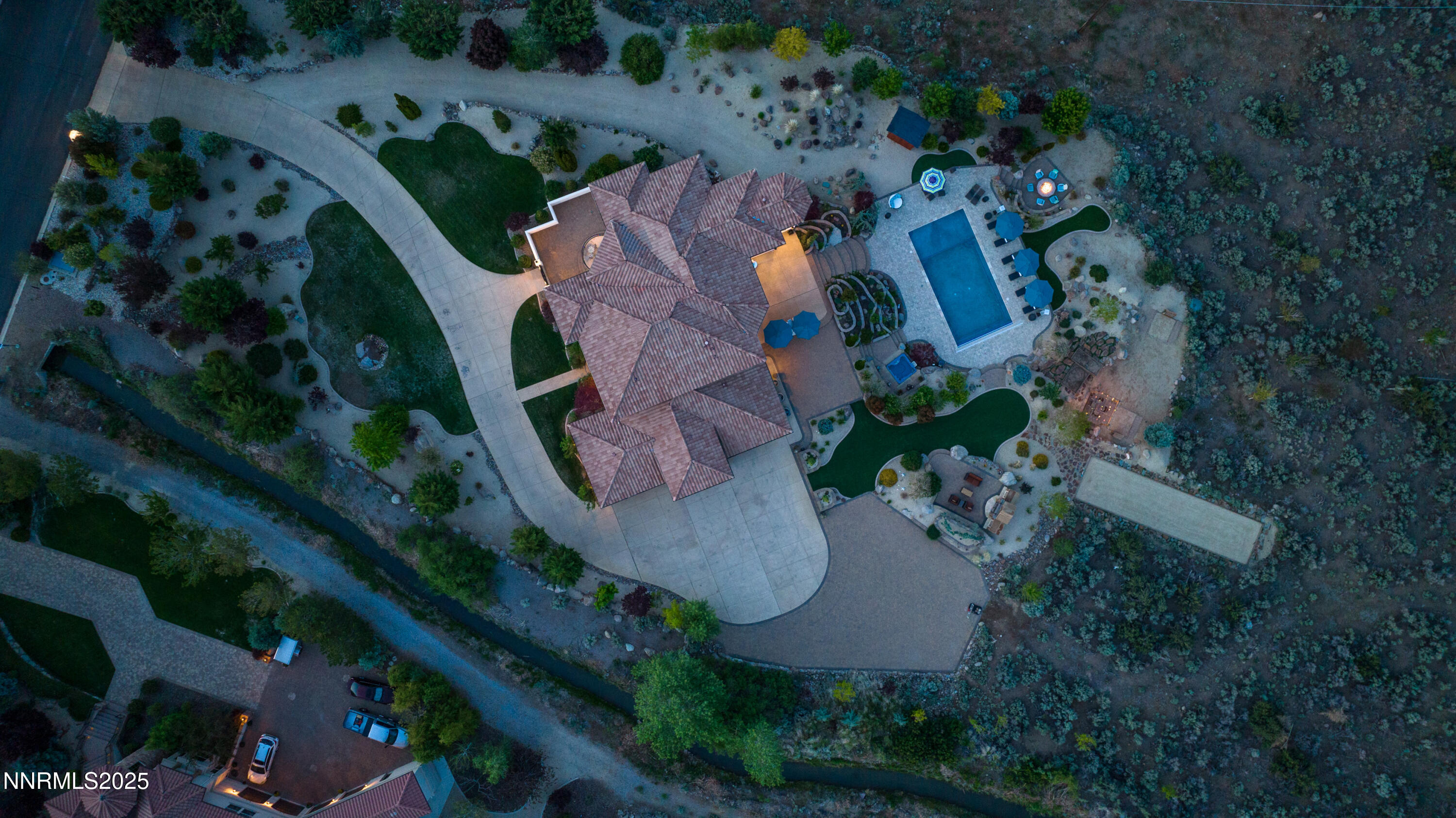 an aerial view of a house with outdoor space and street view