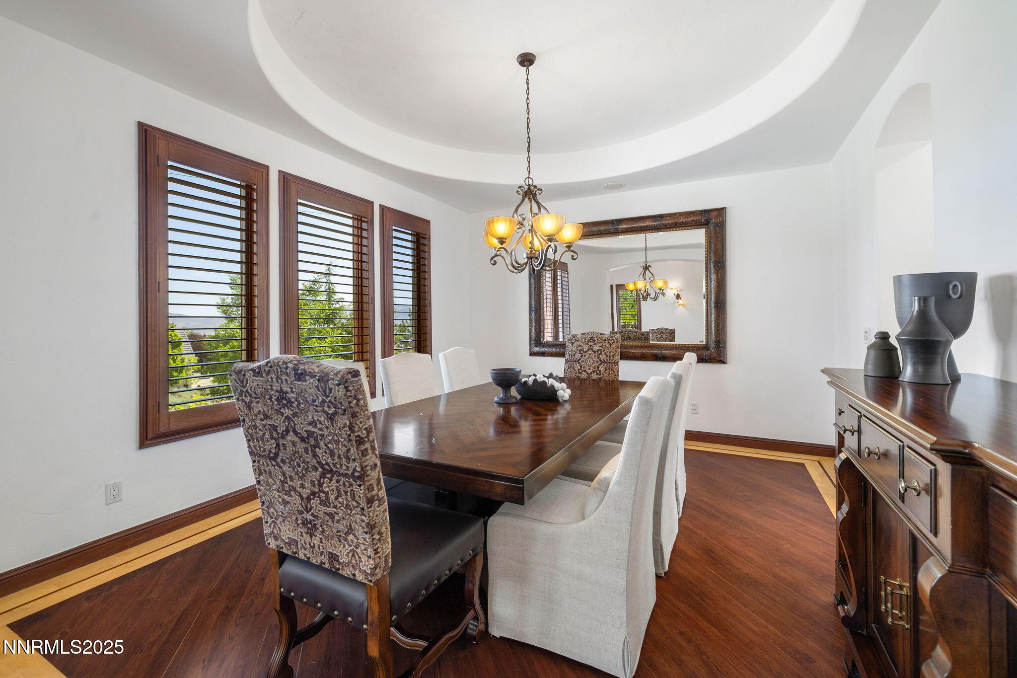 12900 Silver Wolf Road Reno, NV 89511 - Photo 12 of 51 a view of a dining room with furniture window and wooden floor