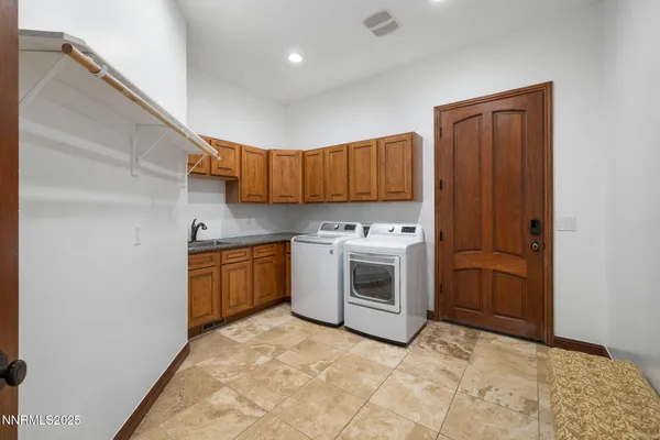 a kitchen with granite countertop a sink and a stove