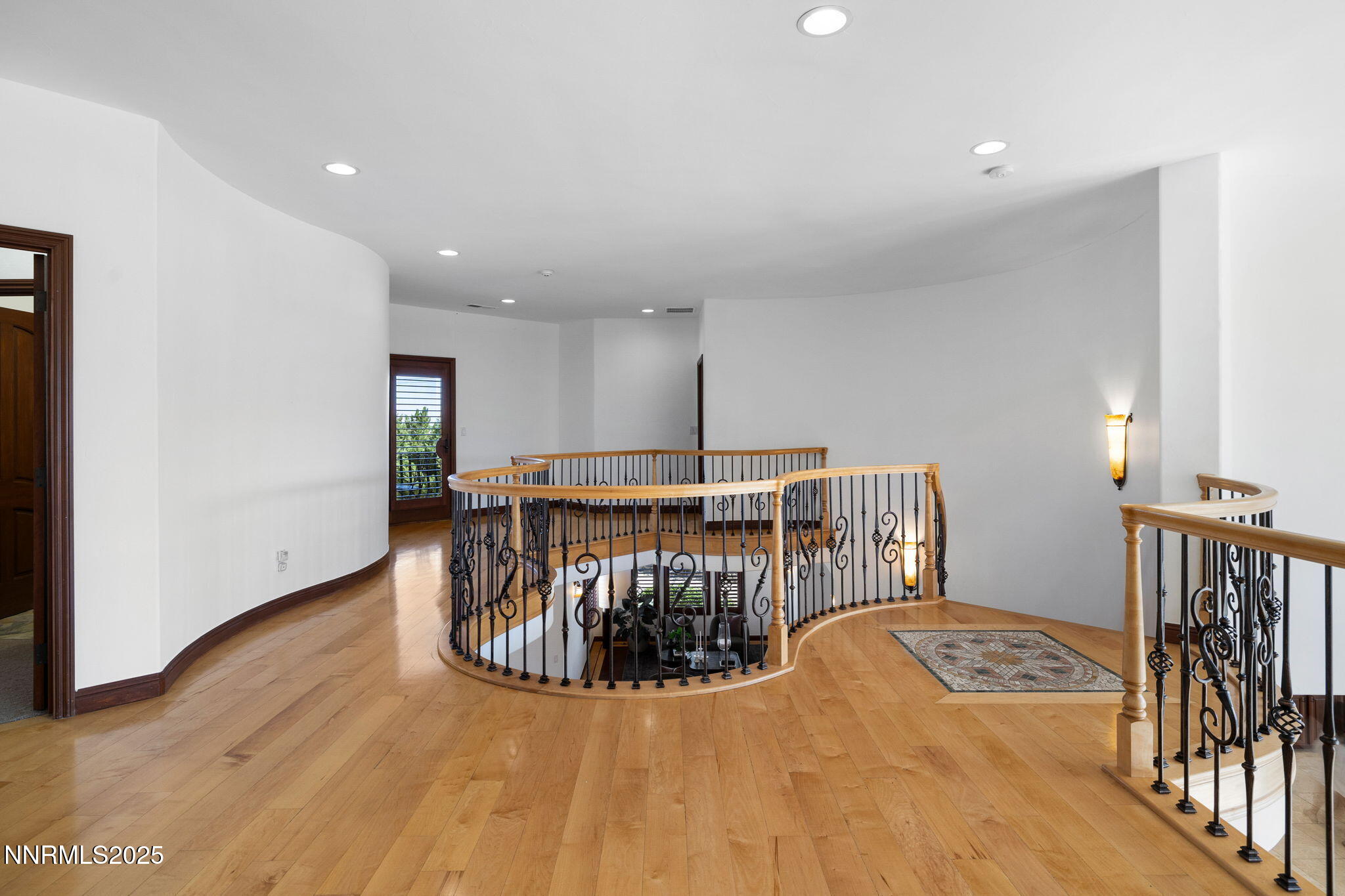 12900 Silver Wolf Road Reno, NV 89511 - Photo 19 of 51 a view of a hallway with wooden floor