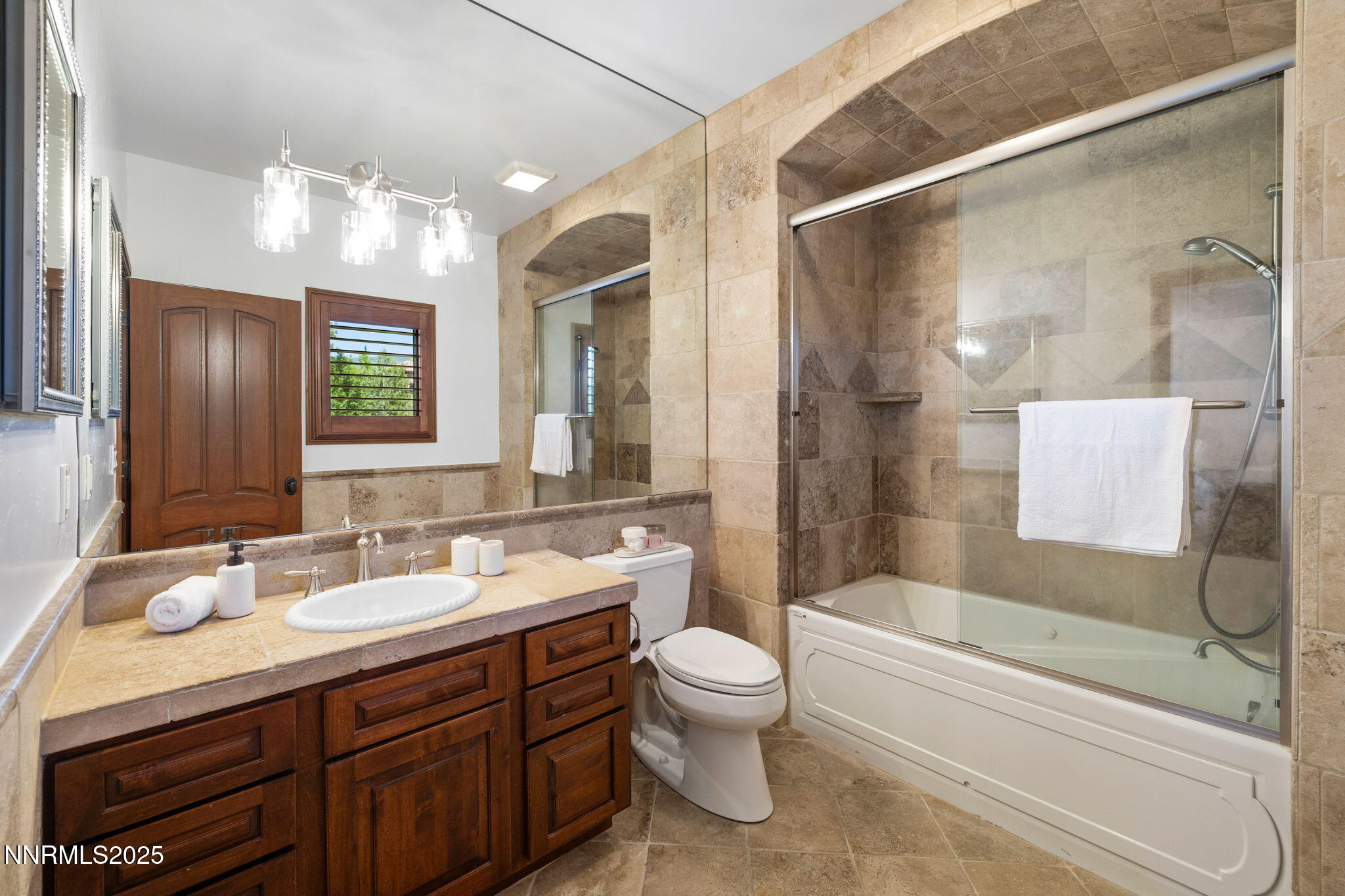 12900 Silver Wolf Road Reno, NV 89511 - Photo 21 of 51 a bathroom with a sink double vanity granite tub and shower