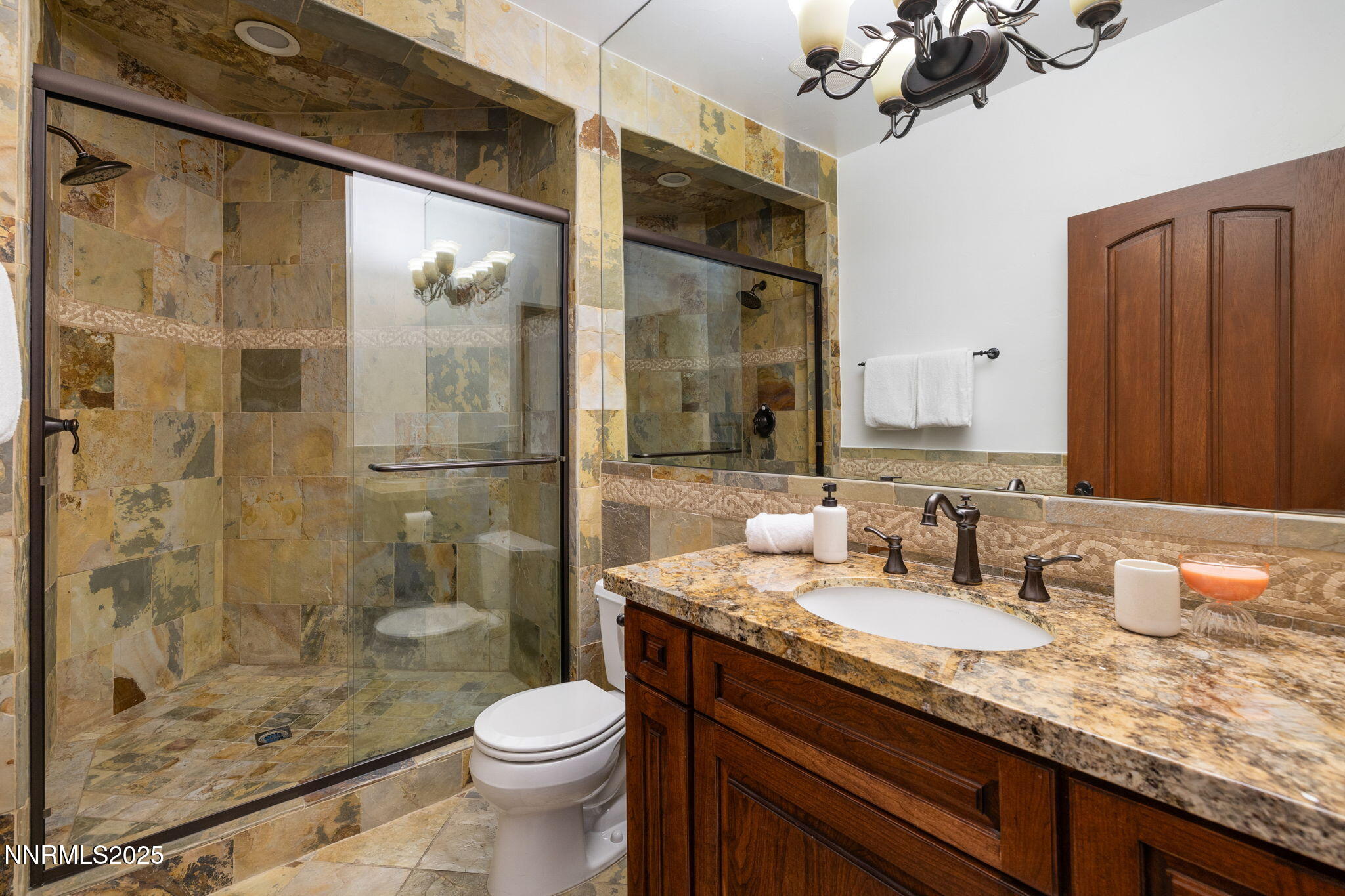 12900 Silver Wolf Road Reno, NV 89511 - Photo 23 of 51 a bathroom with a granite countertop sink toilet and shower