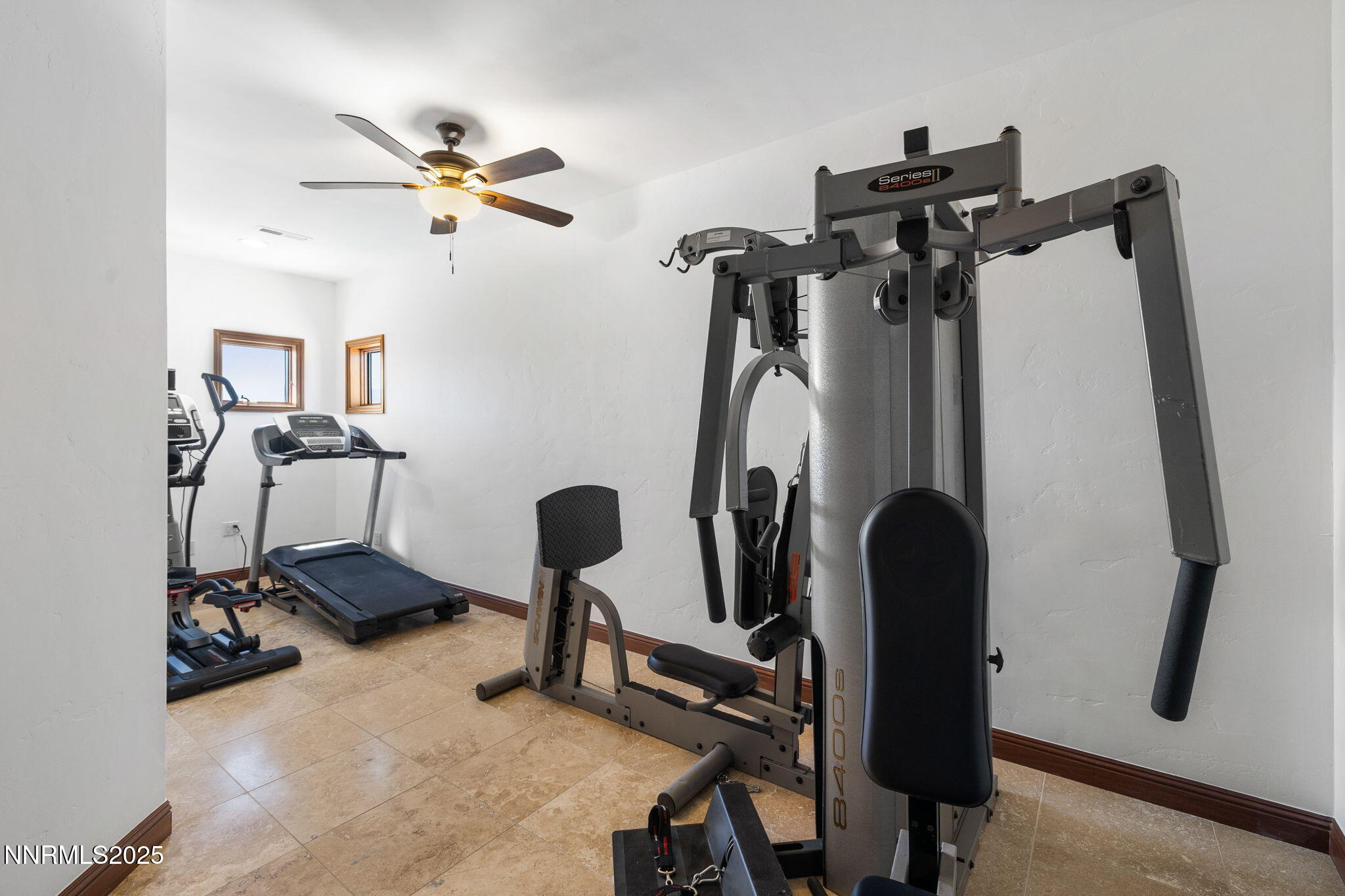 12900 Silver Wolf Road Reno, NV 89511 - Photo 25 of 51 a view of a workspace with furniture and gym equipment