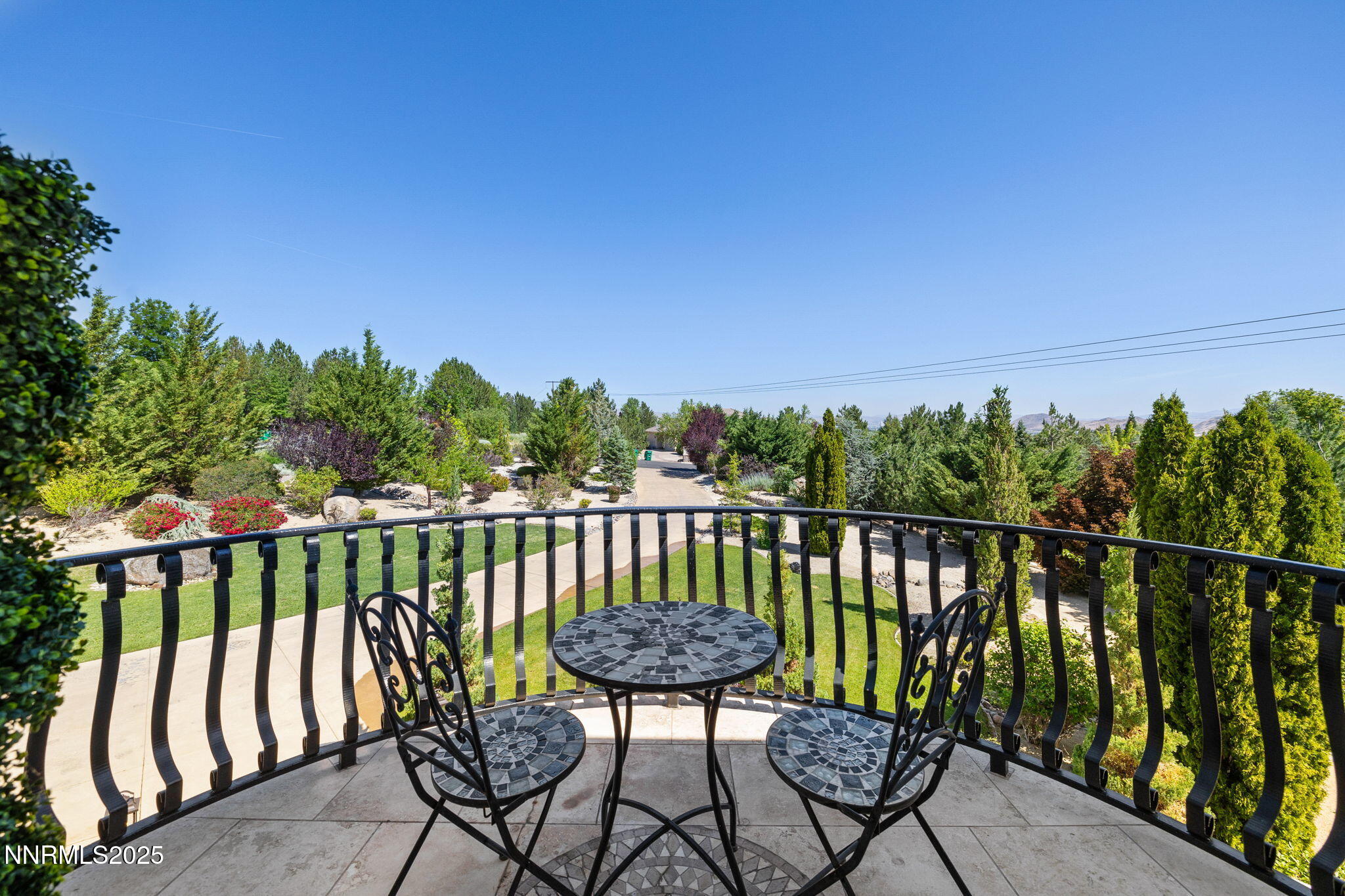 12900 Silver Wolf Road Reno, NV 89511 - Photo 30 of 51 a view of a balcony with chairs and a table