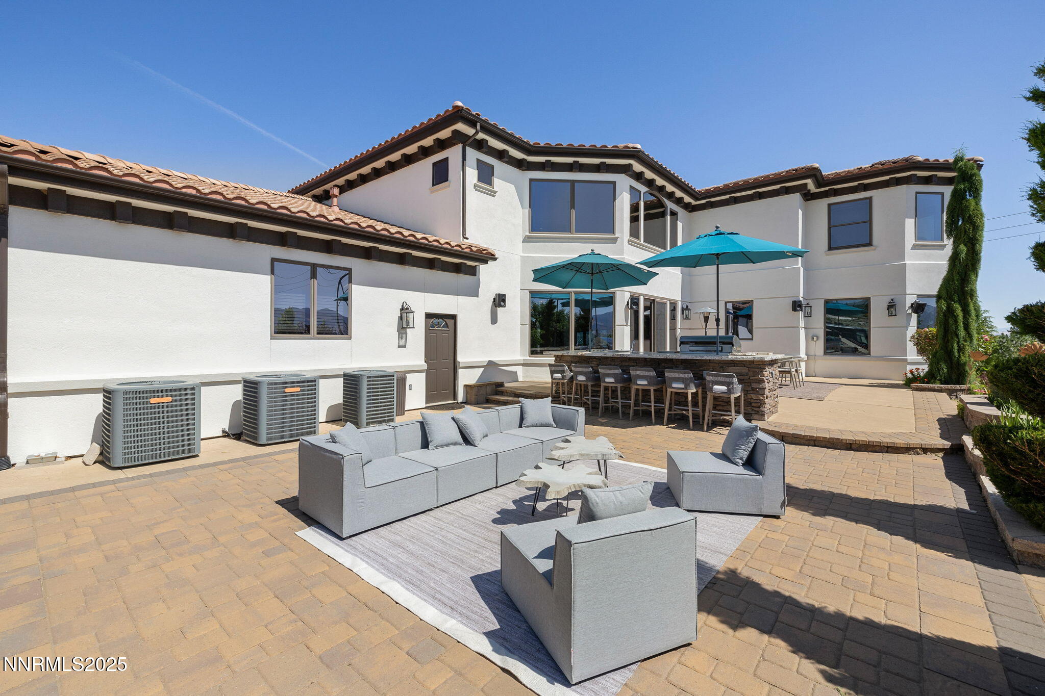 12900 Silver Wolf Road Reno, NV 89511 - Photo 33 of 51 a view of a white house with couches and chairs