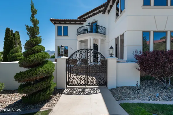 a front view of a house with swimming pool garden and patio
