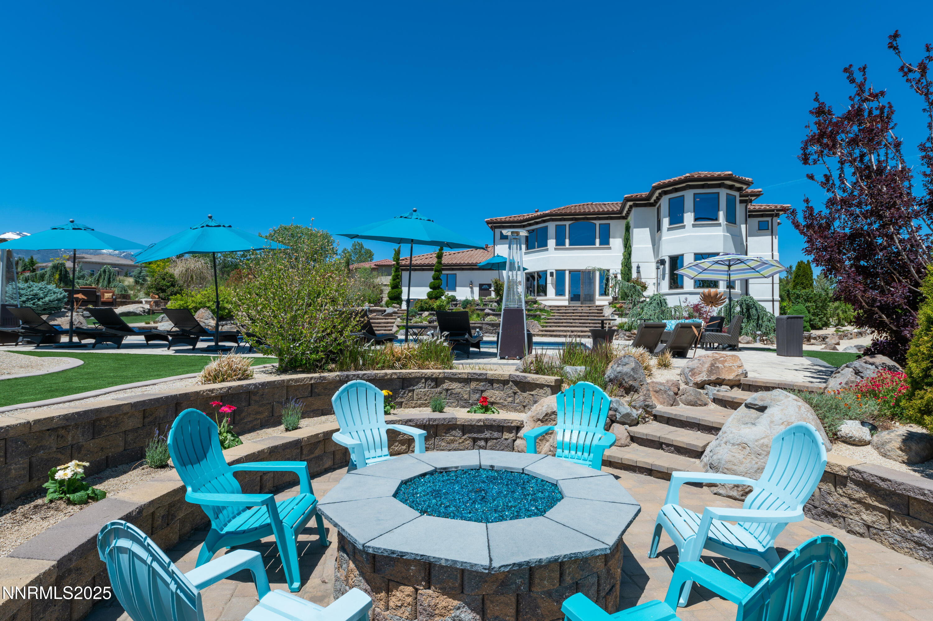 12900 Silver Wolf Road Reno, NV 89511 - Photo 36 of 51 a front view of a house with swimming pool garden and patio