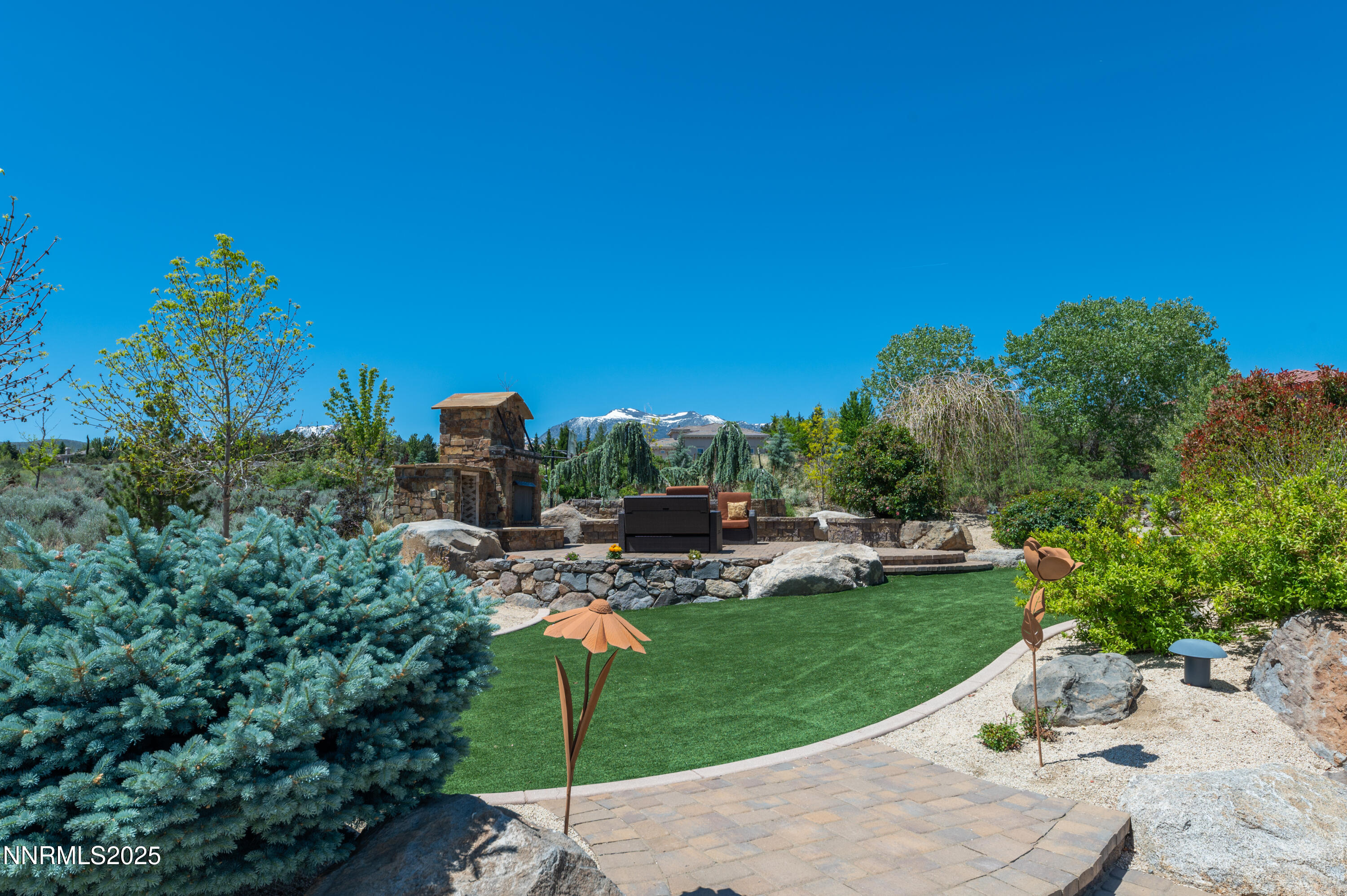 12900 Silver Wolf Road Reno, NV 89511 - Photo 39 of 51 a view of a garden with sitting area