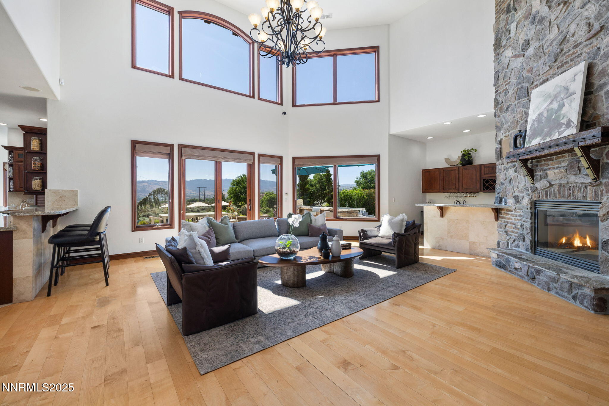 12900 Silver Wolf Road Reno, NV 89511 - Photo 4 of 51 a living room with furniture large window and a fireplace