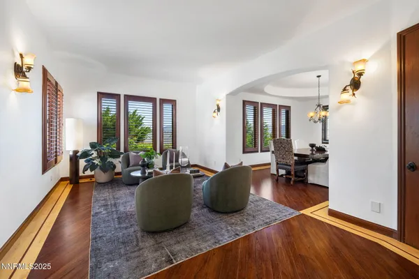 a dining room with furniture and window