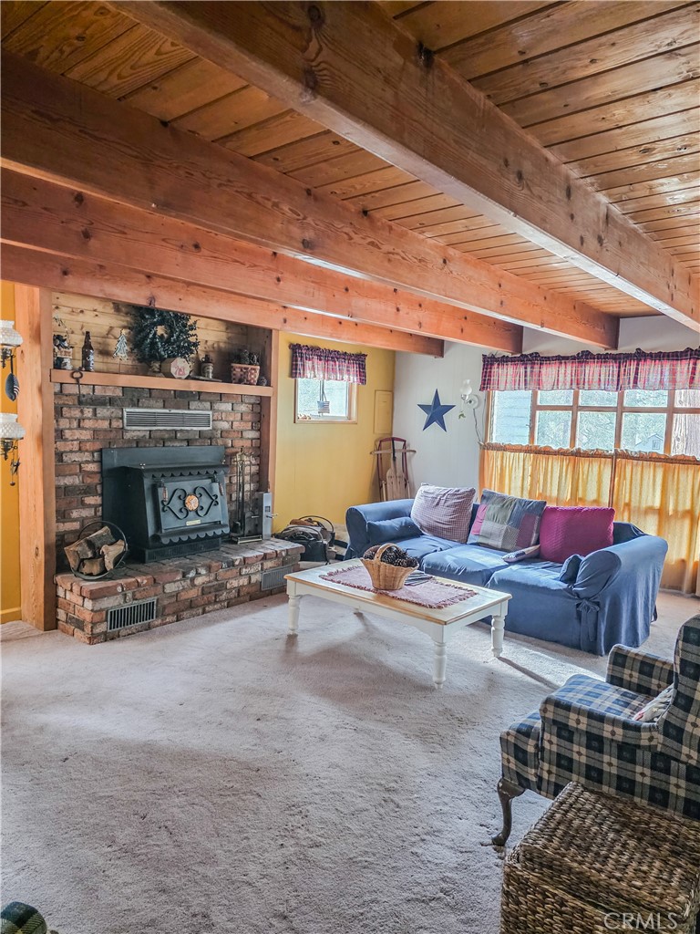 52745 Sylvan Way Idyllwild, CA 92549 - Photo 13 of 31 a living room with furniture and a fireplace