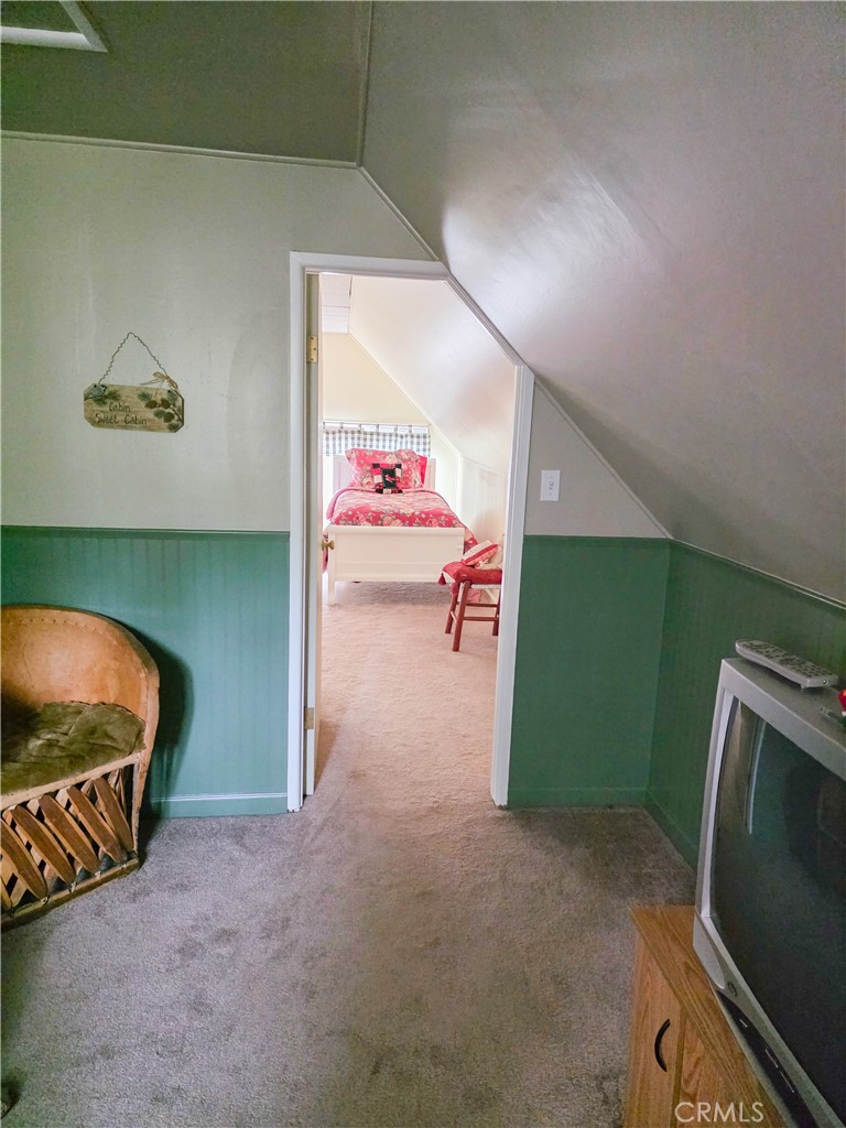 52745 Sylvan Way Idyllwild, CA 92549 - Photo 20 of 31 a living room with furniture and a flat screen tv