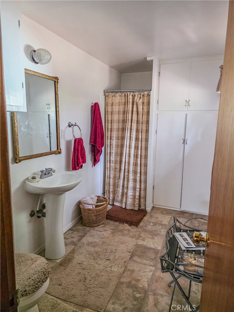 52745 Sylvan Way Idyllwild, CA 92549 - Photo 23 of 31 a bathroom with a sink and a mirror