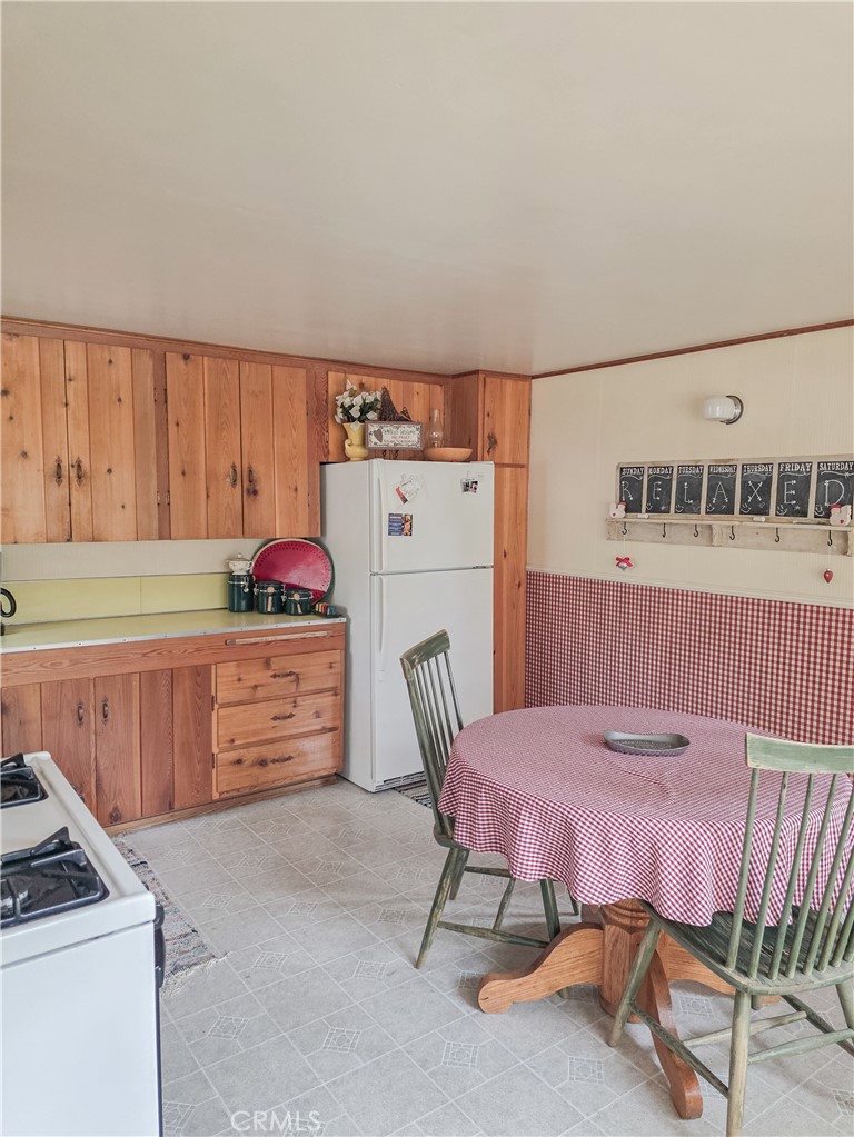 52745 Sylvan Way Idyllwild, CA 92549 - Photo 27 of 31 a kitchen with stainless steel appliances sink cabinets and wooden floor
