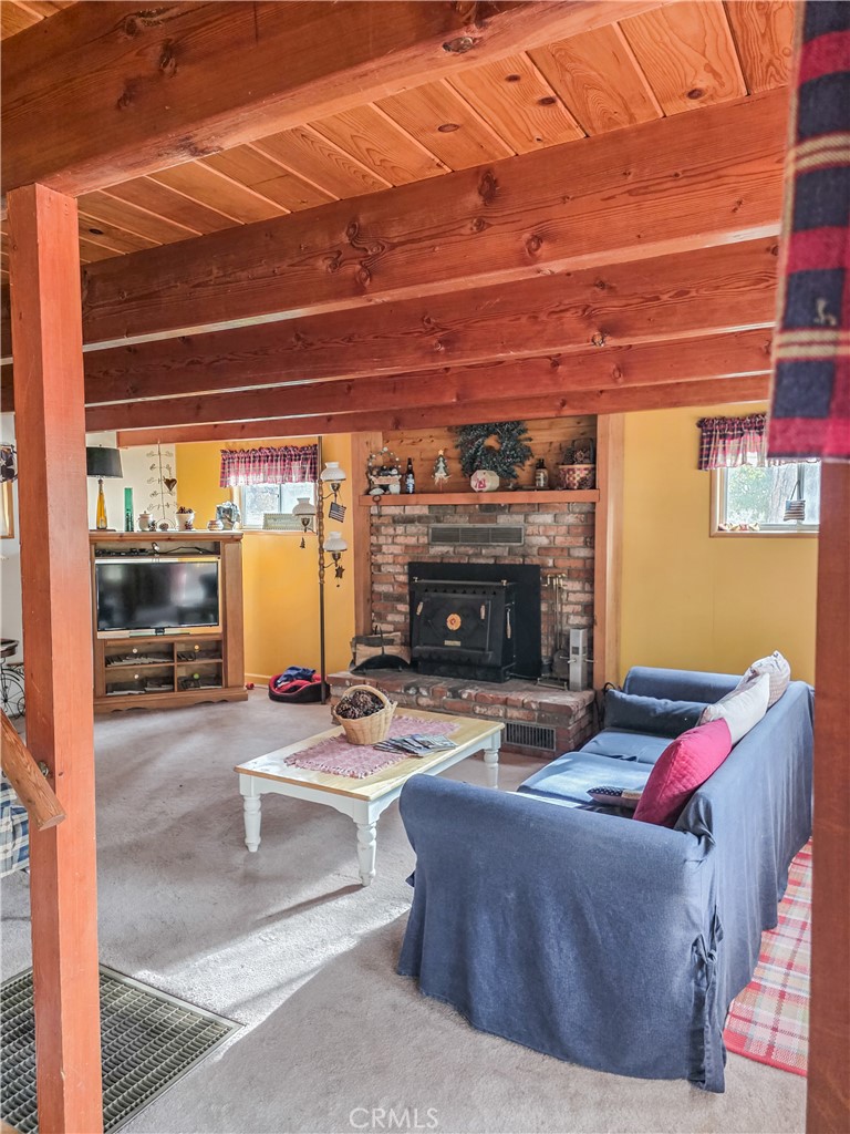 52745 Sylvan Way Idyllwild, CA 92549 - Photo 10 of 31 a living room with furniture and a fireplace