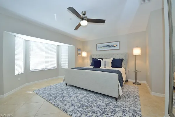 a bed room with a bed and a window