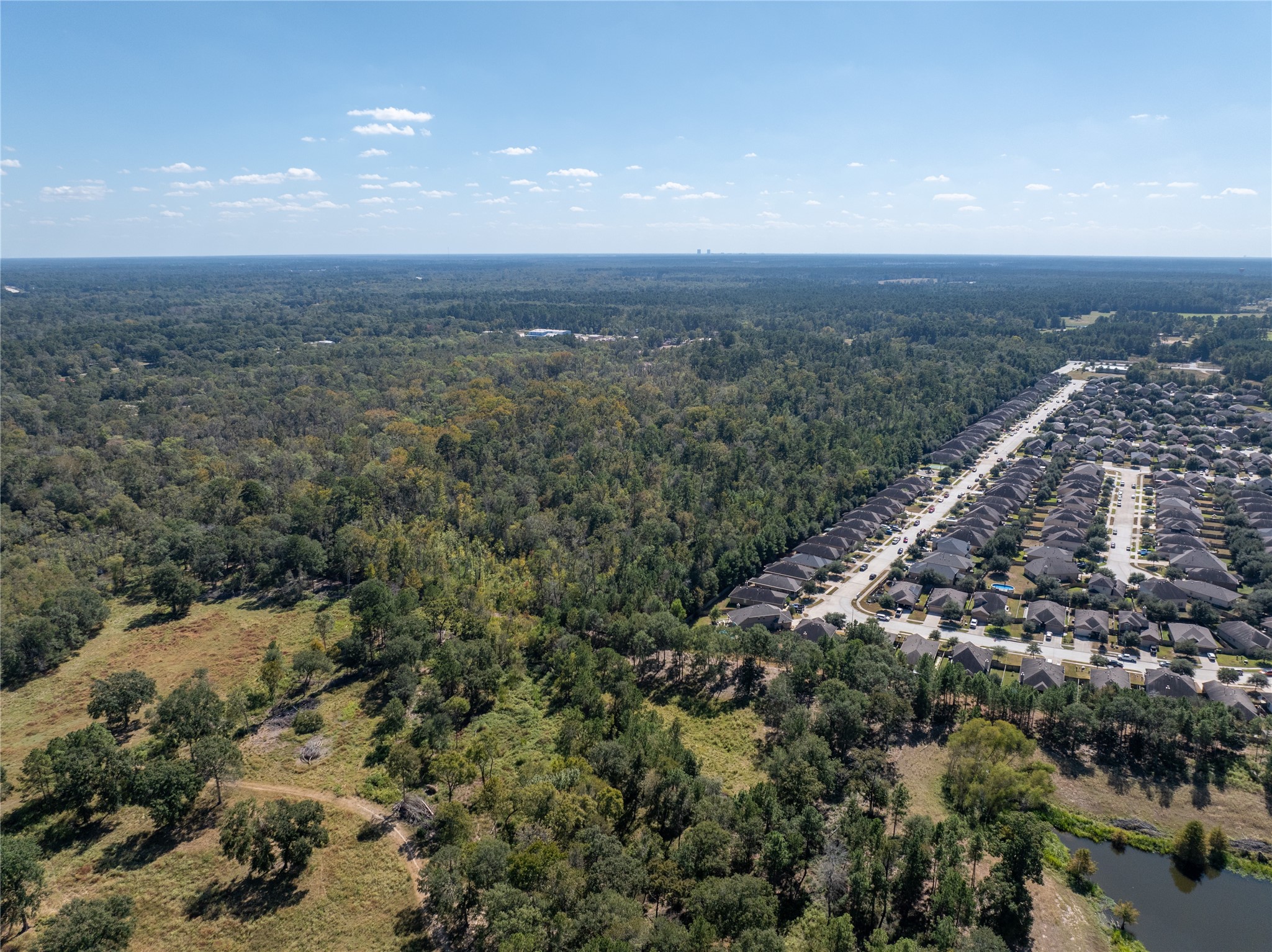 0 Fm 2854 Conroe, TX 77304 - Photo 5 of 15 an aerial view of house with yard and mountain view in back