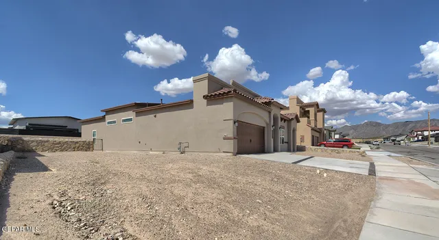 a view of a room with a ceiling fan wooden floor and a ceiling fan