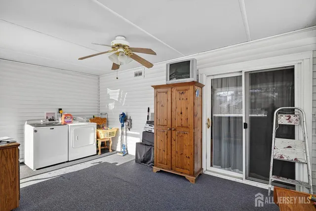 a living room with a flat screen tv and a fireplace
