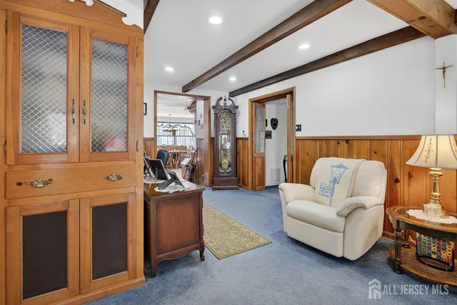 a bedroom with furniture and a large window