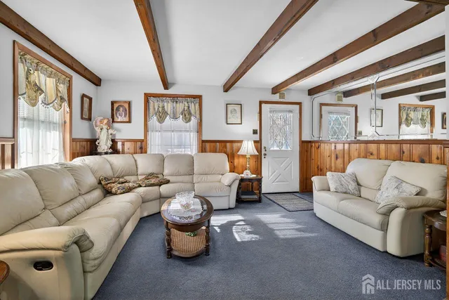 a living room with furniture and a couch