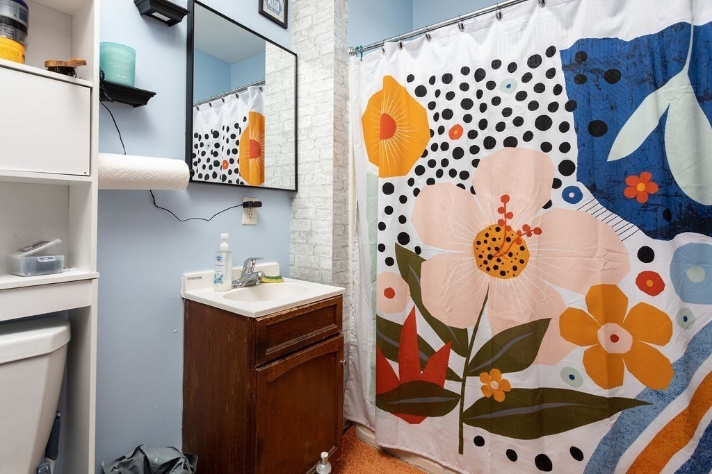 7 Mott Street Worcester, MA 01604 - Photo 11 of 20 a bathroom with a sink toilet and mirror
