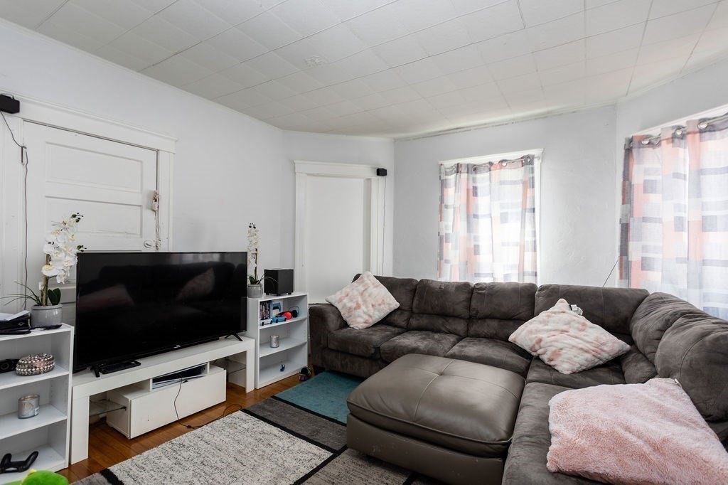 7 Mott Street Worcester, MA 01604 - Photo 12 of 20 a living room with furniture and a flat screen tv