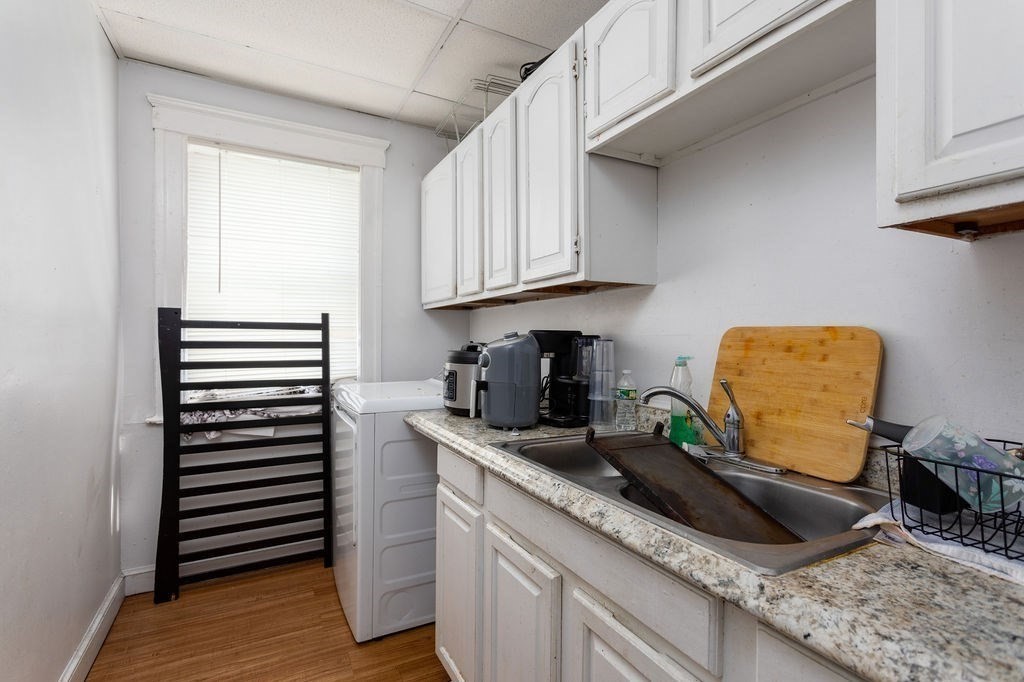 7 Mott Street Worcester, MA 01604 - Photo 17 of 20 a kitchen with sink and cabinets