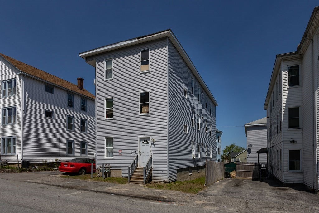 7 Mott Street Worcester, MA 01604 - Photo 2 of 20 a front view of a house with yard