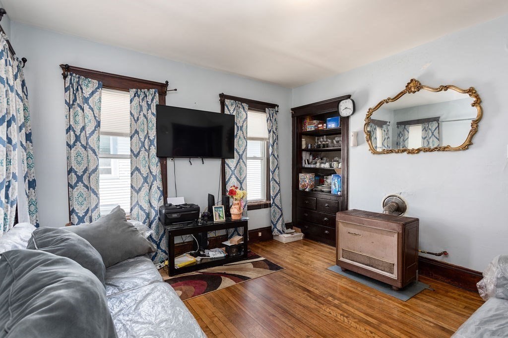 7 Mott Street Worcester, MA 01604 - Photo 4 of 20 a living room with furniture and a wooden floor
