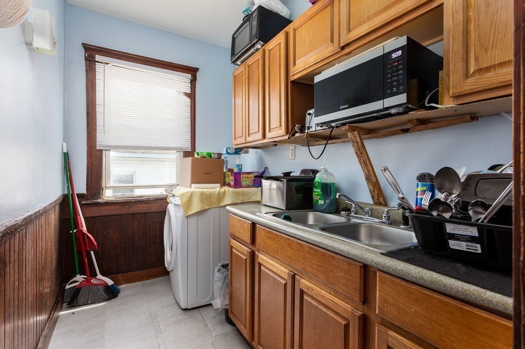 7 Mott Street Worcester, MA 01604 - Photo 8 of 20 a kitchen with a sink cabinets and a window